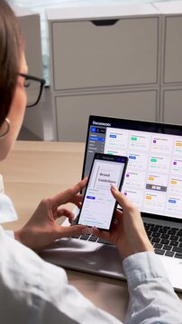 Young Woman Using Document Management Software On Laptop