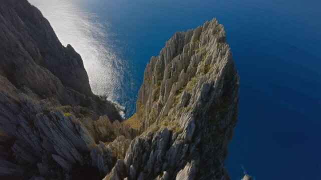 Cala goloritze aerial footage of dramatic rocky cliffs and blue sea