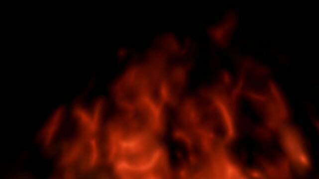Intense flickering orange flames burning against a black background