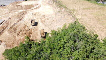 Aerial View of Construction Site Expansion Near Forest Edge and Agricultural Land © Mirko