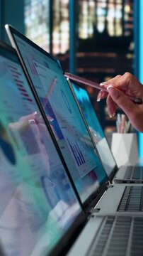 Financial Analyst Reviewing Dashboard Metrics On Laptop