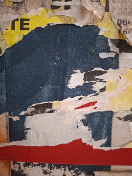 Torn and ripped street poster, grungy background, messy old paper collage