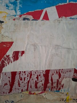 Torn and ripped street poster, grungy background, messy old paper collage