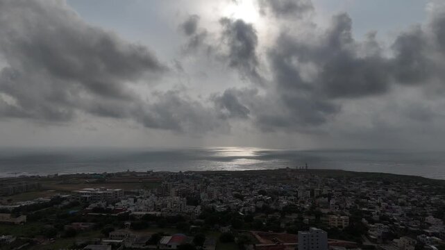 Wide aerial view of Dwarka city and the iconic Dwarkadhish Temple under cloudy sky