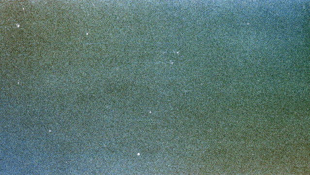 Blank grained film strip texture background with heavy grain, dust and light leak