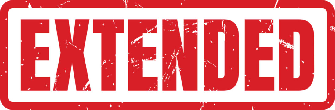 Red rectangular rubber stamp with the word extended in a worn distressed grunge typeface style