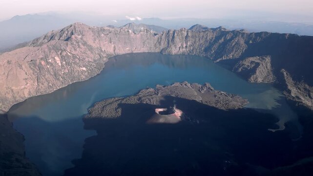 Stunning Altitude Shot Showcasing Serene Turquoise Lake Within Volcanic Rim, Crater And Island