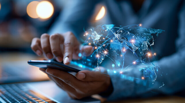 Faceless person interacting with a virtual world map on a transparent screen while holding a smartphone, contemporary workspace with blue light, augmented interface, global data, mobile