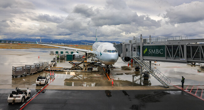 The Cathay Pacific airline fleet operated at KANSAI International Airport in Japan.
