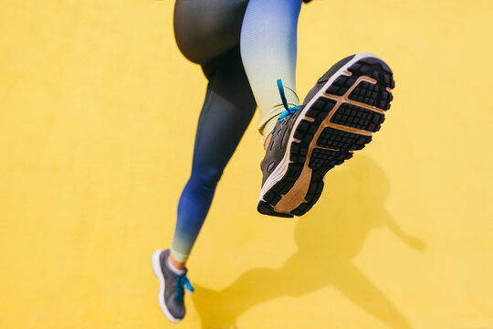 Spain, Barcelona, jogging woman, sole of shoe