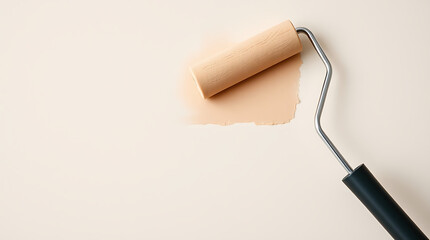 Obraz premium Paint Roller Leaving Stroke Of Beige Color On Wall Renovation Minimalist Concept Copy Space Background