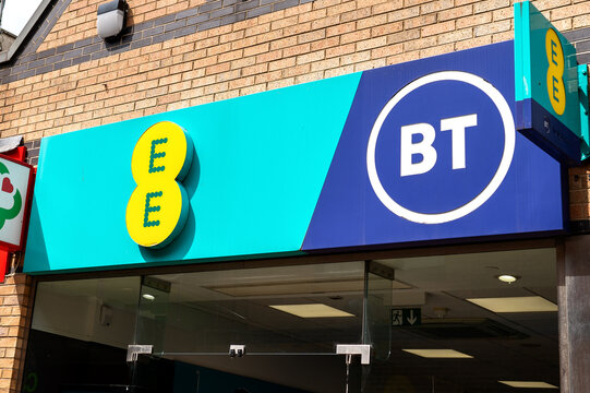EE and BT telecommunications store signage in Corby, Northamptonshire, England, UK