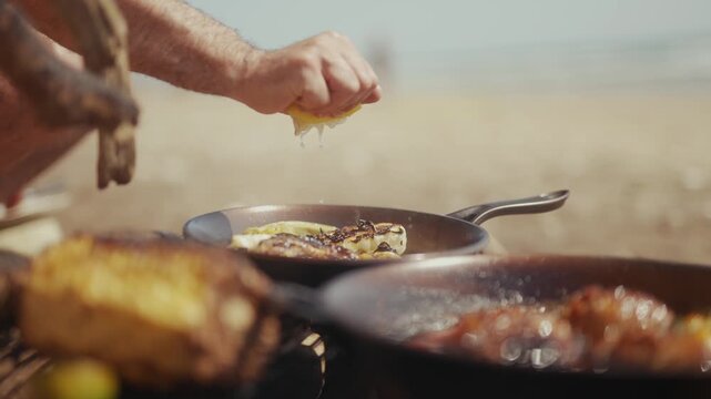 Person squeezing lemon juice onto food in a cast iron pan