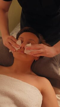 Facial Massage in Spa Salon Slow Motion, Vertical Video Cozy Warm Light Atmosphere