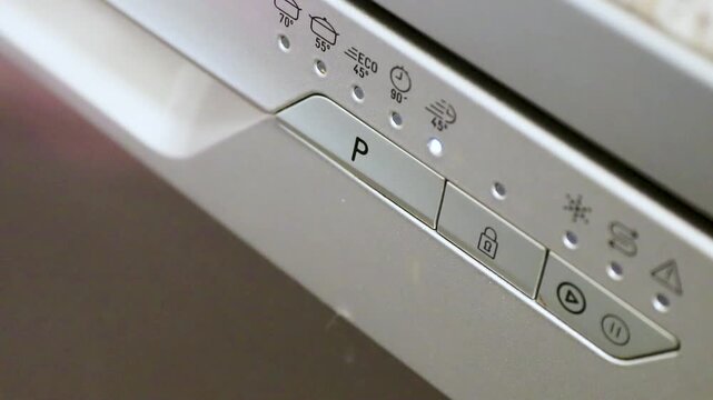 switching on the domestic dishwasher with a wash program