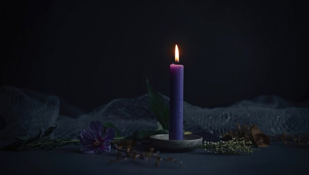 Dark background with violet candle flame and subtle funeral symbolic props