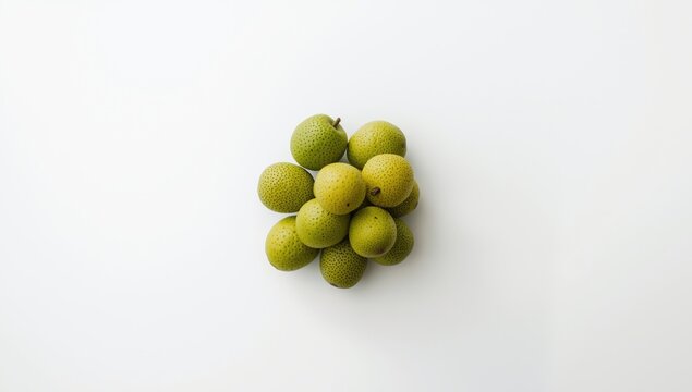 Cluster of feijoas isolated against a smooth white backdrop
