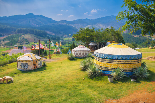 mongolian style yurts in peaceful mountain landscape