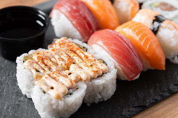 Assorted Sushi Selection and soy sauce on a Japanese restaurant table © chandlervid85