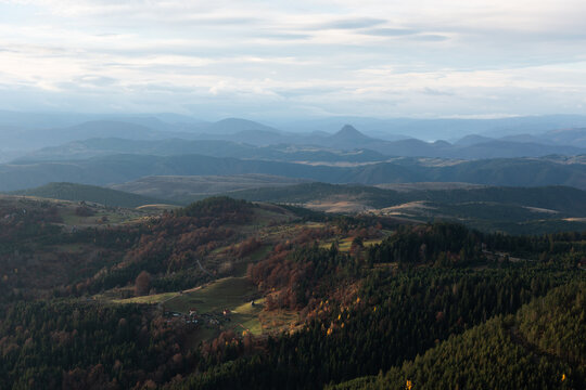 Hilly landscape with village on south of Serbia, mountain layers in distant haze