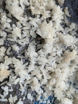 Leftover rice is dried in the sun on a bamboo tray, in Indonesia it is called nasi aking