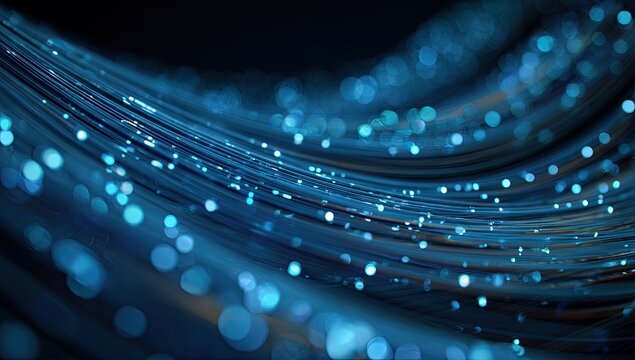 Abstract flowing strands of light with shimmering blue bokeh on a dark background