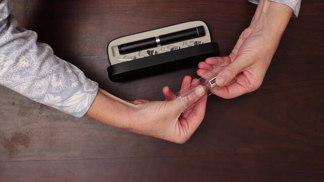 Wolverine medication is taken from packaging for medical injection pen