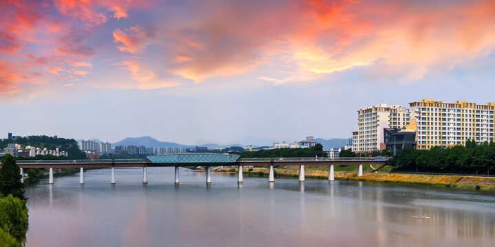 Daegu City sunset landscape and dramatic cloudscape over the Geumho River and historic landmark Ayang Railway Bridge in Gyeongsangbuk‑do, South Korea