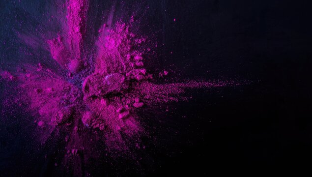 Energetic color powder burst with cosmetic brush on dark canvas