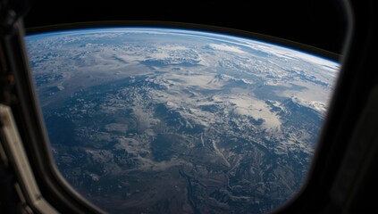 Naklejka premium Earth's continents visible from the space station window frame