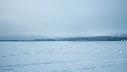 Fototapeta premium crisp cold winter scene with snow laden ground and distant hills