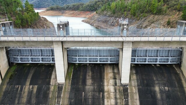 Concrete hydro dam structure holding reservoir water