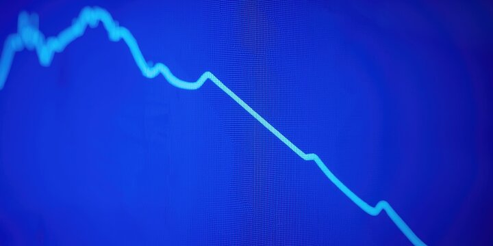 Forex trading graph with an exponential decline curve on a cobalt blue screen