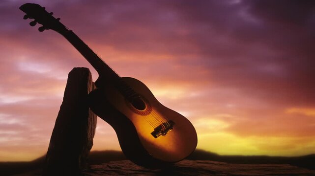 Country Music. A guitar leaning against a rock at sunset 