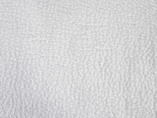 Light gray fleece fabric texture background with soft synthetic fibers © sunkit