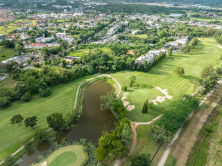 Obraz premium Aerial view drone shot of beautiful golf field in Phuket island Thailand