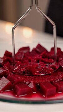 Hand Mashing Beetroot Cubes on Plate Closeup Sequence Bright Red Color Culinary Process Ingredient Transformation Conceptual Scene