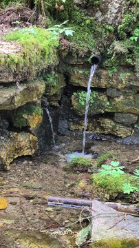 Stone pond with running water.
