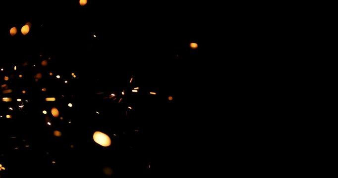 Dynamic metal sparks against a deep black background, making it ideal for motion graphics and special effects. This footage is perfect for designers and artists seeking unique abstract visuals