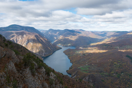 Artificial lake Perucac surrounded with mountains during cloudy day, view point Banjska stena on Tara mountain