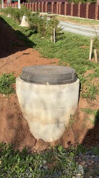 Septic tank or cesspool built of reinforced concrete rings. Vertical