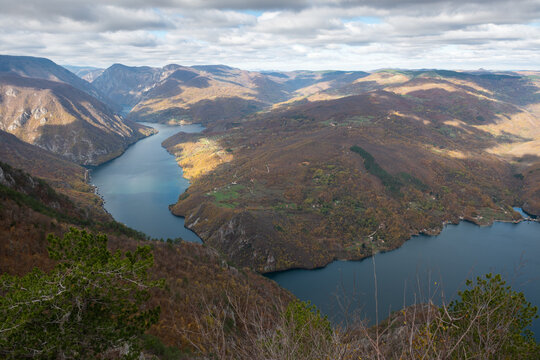 Artificial lake Perucac surrounded with mountains during cloudy day, view point Banjska stena on Tara mountain