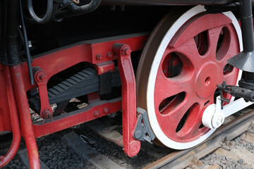 Red vintage steam locomotive wheel at the station © aviavlad