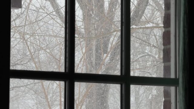 Snow falling outside of house window 4k
