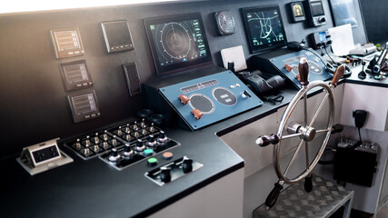 Digital dashboard with navigation monitor system, radar and VHF Radio in ship captain bridge or boat engine control room. Wheelhouse steering console on maritime transport. Nautical vessel technology © zephyr_p