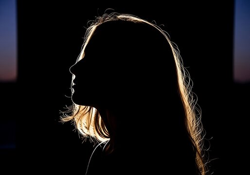 Silhouette of a young woman with glowing hair profile illustration