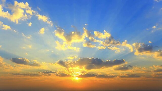 Cinematic golden sunrise with sunbeams through clouds, bright morning sky with sun rays, ethereal sunset atmosphere for background video