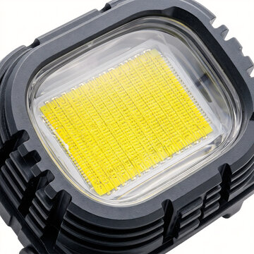 Extreme macro of a COB LED array in an ultralight trail running headlamp. Yellow phosphorous grid and clear optical lens isolated on white.