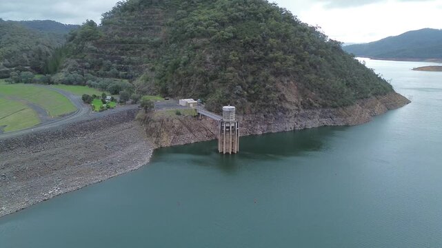 Aerial view of lake eildon dam wall and water intake tower