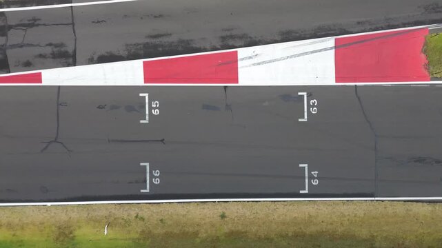 Racetrack starting grid aerial view traveling forward